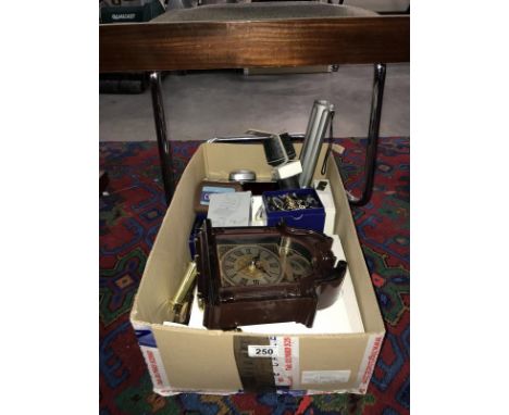 A box of miscellaneous including wall clock, enamel eggs &amp; torches etc.