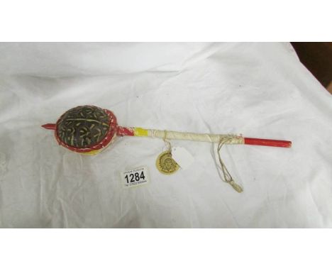 A vintage Indian made tortoise shell rattle instrument.