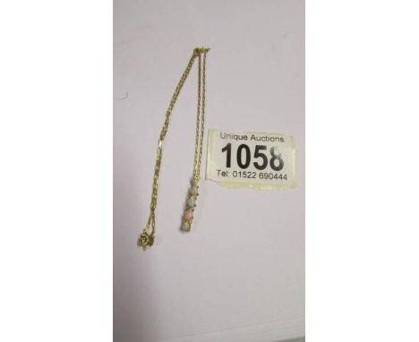 A 9ct gold and opal pendant on a 9ct gold chain, 2.6 grams.