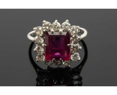 18CT WHITE GOLD BELIEVED SPINEL & DIAMOND CLUSTER RING, the central claw set rectangular stone (9 x 8mms approx.) within a bo