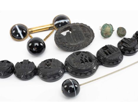 GROUP OF JEWELLERY comprising carved graduated panel bracelet depicting churches / abbeys, similar brooch, scarab ring and lo