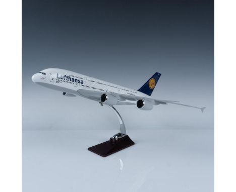 A collectible figure of the German wide-body passenger airliner. The figure is attached to a base. This item has a box: 17.5"