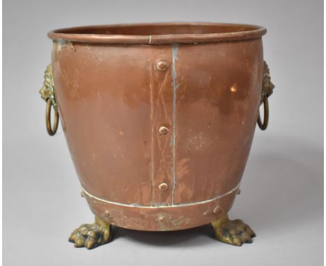 A Brass Mounted Copper Cylindrical Planter with Lion Mask Handles and Three Claw Feet, 20cm Diameter 