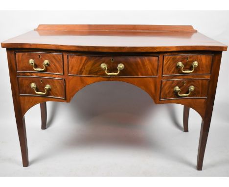 A 19th Century Mahogany Serpentine Front Side Table with Galleried Back, Long Centre Drawer Flanked by Two Shorter Drawers Ei