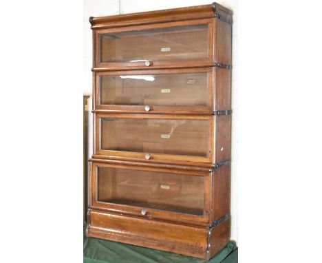 A Four Tier Globe Wernicke Bookcase, 86cm wide and 142cm high 