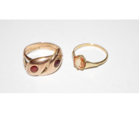 A 9ct rose gold snake ring set with red stones, Chester hallmark, size N, 4.8g; a 9ct gold cameo ring, size K, 1.1g (2)