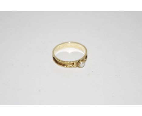 A Victorian mourning ring with seed pearls