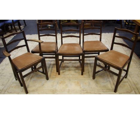 Four Ercol oak ladder back dining and a conforming carver. (5)