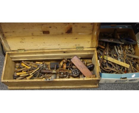 A small Carpenter's pine chest and tools including chisels, hand drills, braces, oil stones, spanners, etc