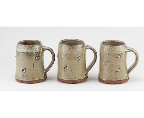 JIM MALONE (born 1946); a trio of stoneware mugs covered in nuka glaze with impressed decoration, impressed JM and L (for Les