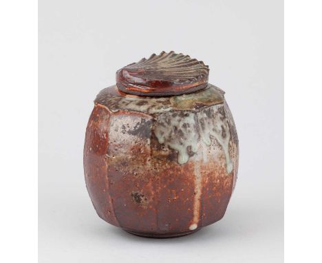 † STEVE BOOTON (born 1957); a faceted wood fired stoneware caddy covered in shino and ash glaze, impressed SB mark, height 13