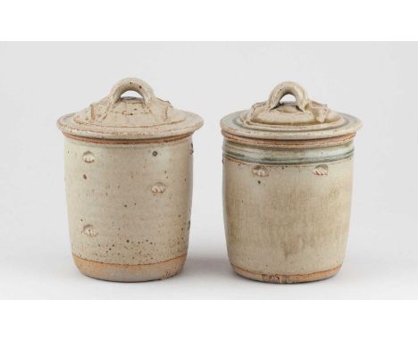 JIM MALONE (born 1946); a near pair of stoneware jars and covers covered in green ash glaze, impressed JM and L (for Lessonha