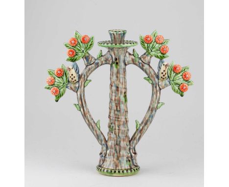 † PAUL YOUNG (born 1961); a slip decorated earthenware candlestick, height 29cm.Condition Report: Appears good with no obviou