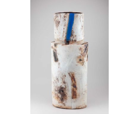 † ROBIN WELCH (1936-2019); a very large oval stoneware bottle form covered in cream glaze with iron staining, a blue stripe t