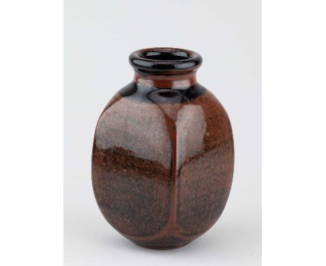 † DAVID LLOYD JONES (1928-1994); a square stoneware bottle covered in tenmoku breaking to kaki glaze, impressed LJ mark, heig
