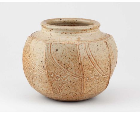 † DAVID LLOYD JONES (1928-1994); a stoneware cut sided jar covered in oatmeal glaze with iron spots and incised decoration, i
