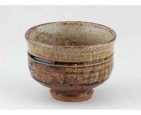 † JIM MALONE (born 1946); a stoneware chawan covered in green ash and kaki glaze, impressed JM and L (for Lessonhall) marks, 