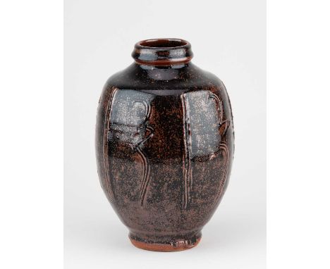 JIM MALONE (born 1946); a stoneware bottle covered in tenmoku breaking to kaki glaze with incised decoration, impressed JM an