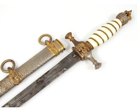 An Imperial German Kriegsmarine dagger, having Carl Eickhorn blade, fouled anchor motif to cross guard leading to celuloid gr