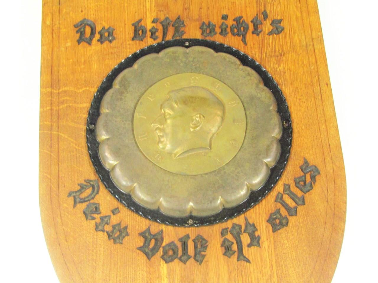 A Third Reich Hitler Jugend oak shield, entitled 'Du Bist Nichts Dein Volk sind Alles' 'You A A Third Reich Hitler Jugend oak shield, entitled 'Du Bist Nichts Dein Volk sind Alles' 'You A