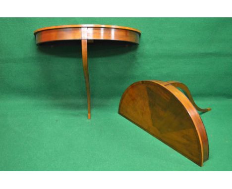 Pair of satinwood demi lune console tables having cross banded top supported on single square tapering sweeping leg - 36" wid