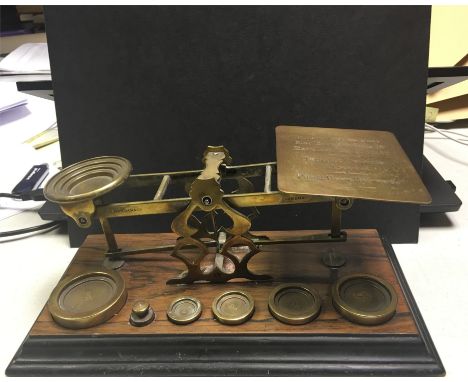 Postage scales (Inland Letter Post 1d) with original weights.