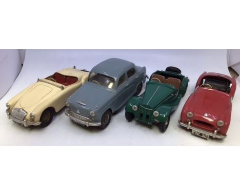 Victory: A collection of four unboxed Victory Industries, battery operated vehicles to comprise: Triumph TR2, red body with n