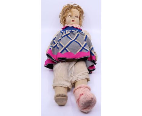 Doll: An early 20th century cloth doll in the style of Chad Valley, approx. 18". The doll is in need of attention, the left l
