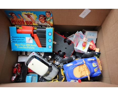 Mixed lot of die cast cars together with Magic Roundabout figures, potato gun and other items 