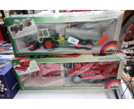Pair of boxed Siku Tractor, Trailer and Combine 