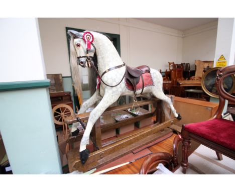 Superb Victorian large rocking horse with leather seat, horse hair mane and tail, all in good condition and working 