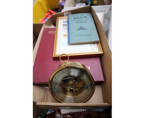 Magpie lot of a modern wall mounted barometer, 2 small stamp albums and larger album, 3 children's comics and a metal sifter 