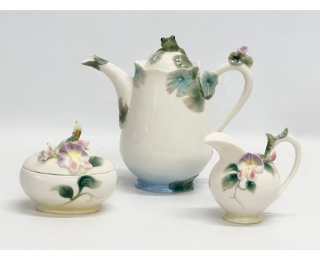 A Franz porcelain 3 piece tea service. A Franz Amphibia teapot, with a Franz creamer and sugar bowl by Wei Xuei Mei.