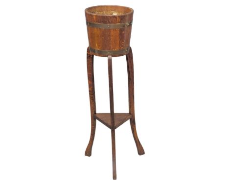 An Early 20th Century oak planter on stand. (9)