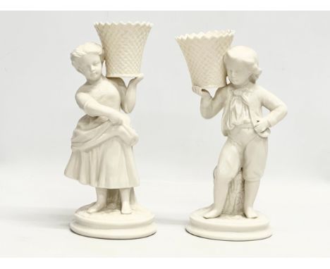 A pair of Late 20th Century Belleek Pottery basket carrier figures. 22cm