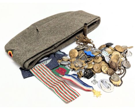 A collection of vintage military badges, predominantly World War II.