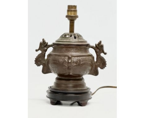 a Chinese bronze archaic style converted lamp. 19x26cm