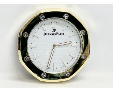 An AP Audemars Piguet adverting wall clock. 33cm