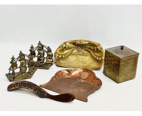 A collection of 19th and Early 20th Century brass and copper. A pair of Victorian brass sailing ship bookends. Art Nouveau cr