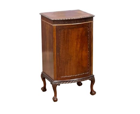 A 1930’s Chippendale Revival mahogany bow front pedestal side cabinet. 52x43x94cm (3)