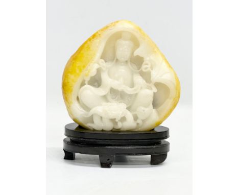 A Chinese carved jade on stand. 16.5x20.5cm