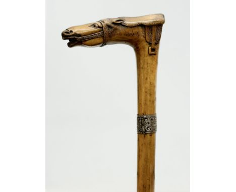 An Early 20th Century silver mounted walking stick. 90cm