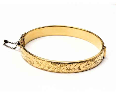 A rolled gold bangle / bracelet.