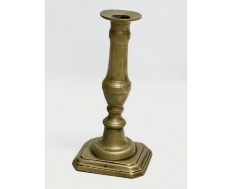 A George III, Late 18th Century brass candlestick. 20cm