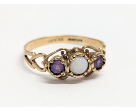 A 9ct gold ring with opal and amethyst stones. Total weight 2g. UK size R