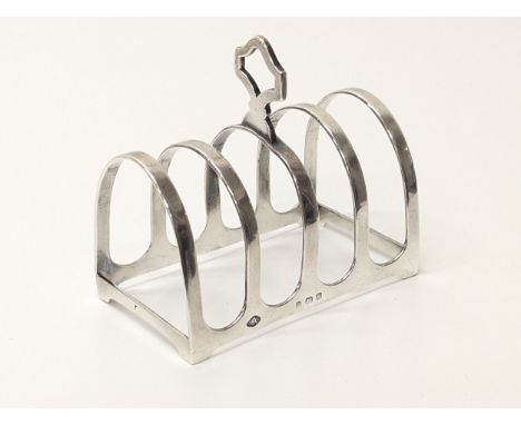 A Birmingham silver toast rack. Stamped Selfridge &amp; Co LTD London. Adie Brothers LTD. 47.5 grams