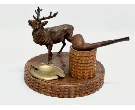 An Early/Mid 20th Century smokers pipe stand with copper stag. 20x17cm