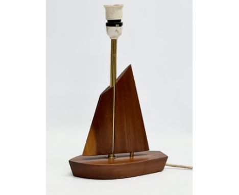 A 1960’s Mid Century teak table lamp. 21x10x34cm