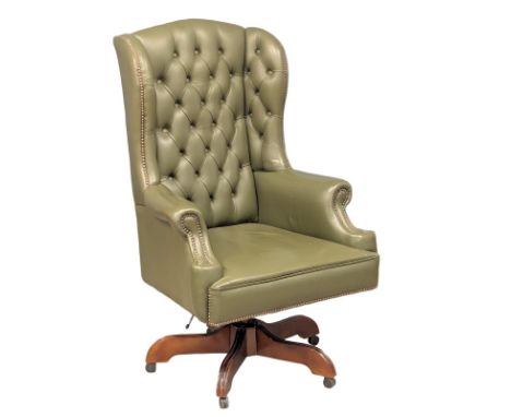 A large deep button back leather swivel chair. 77x129cm.1