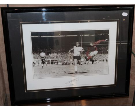 Geoff Hurst Signed Photograph showing Hurst scoring the fourth goal in the 1966 World Cup Final With Soccer Speaker Certifica